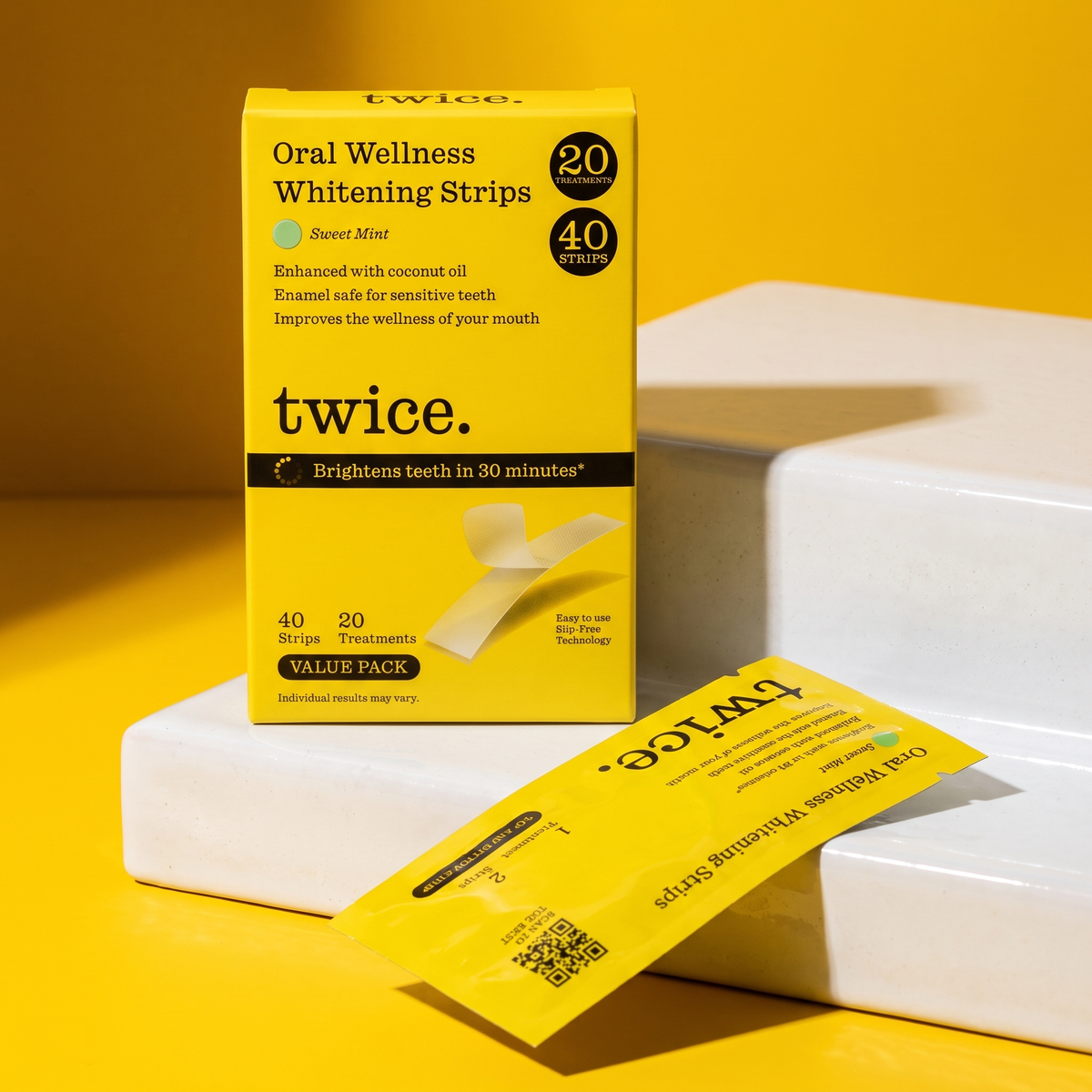 Sweet Mint whitening strips packaging on white ceramic steps.