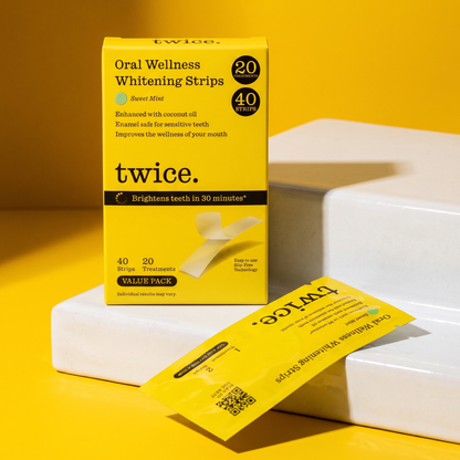 Sweet Mint whitening strips packaging on white ceramic steps.